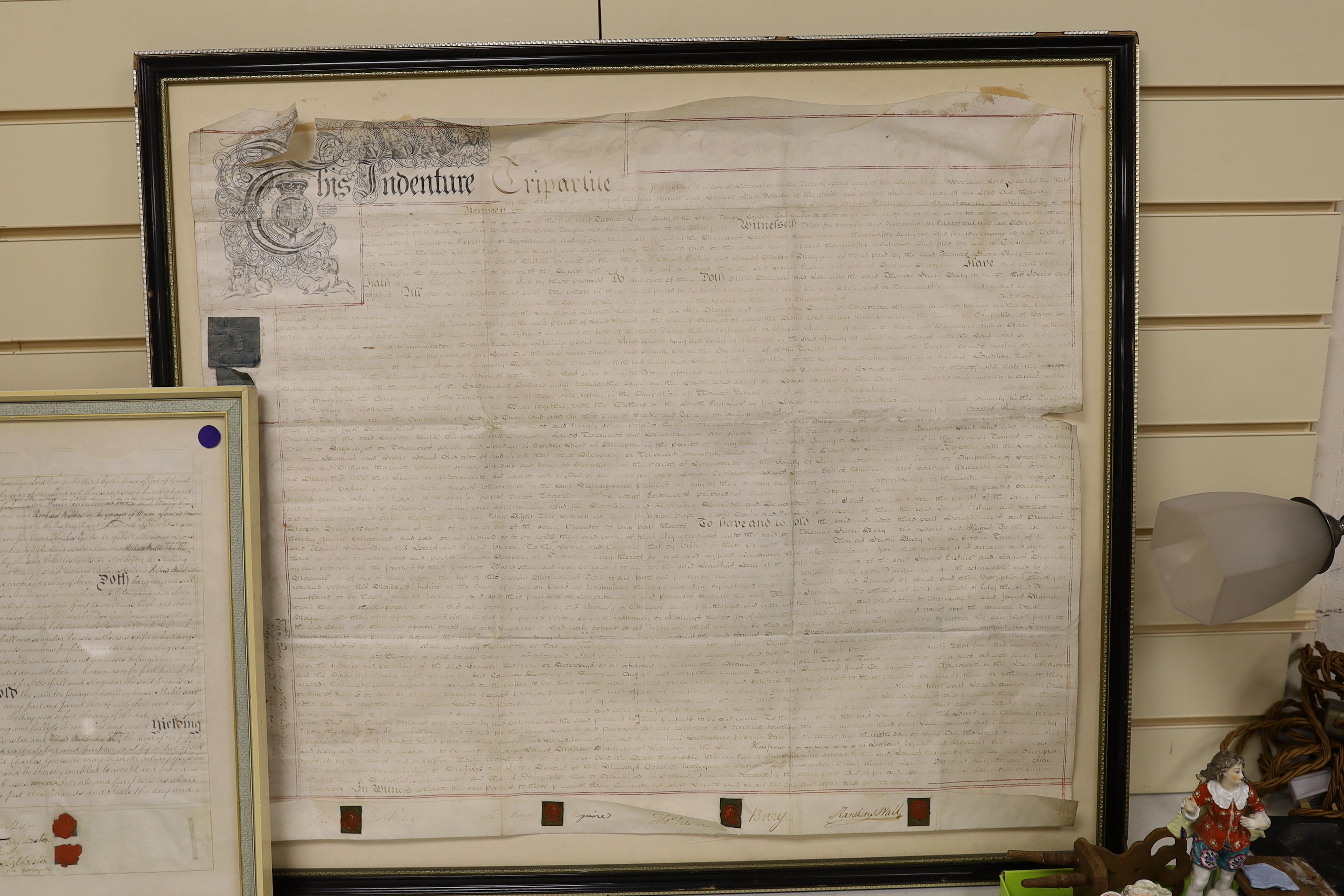 Two framed 18th century indentures, on vellum, largest 75cm wide x 63cm high